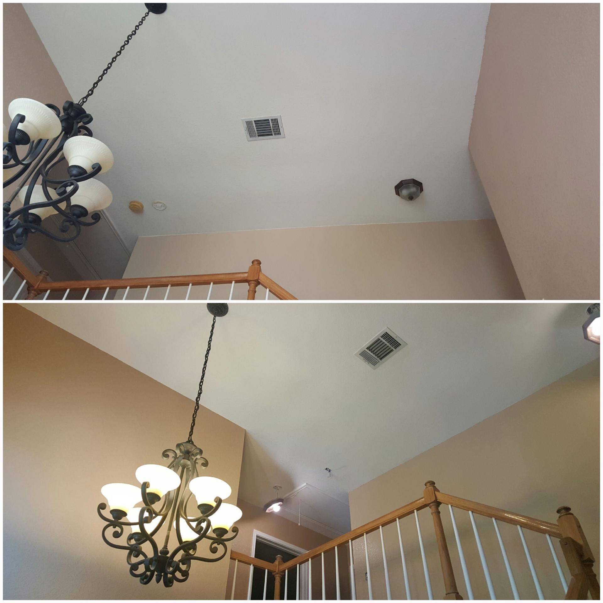 Before and after vaulted stairwell repaint with fresh trim and walls